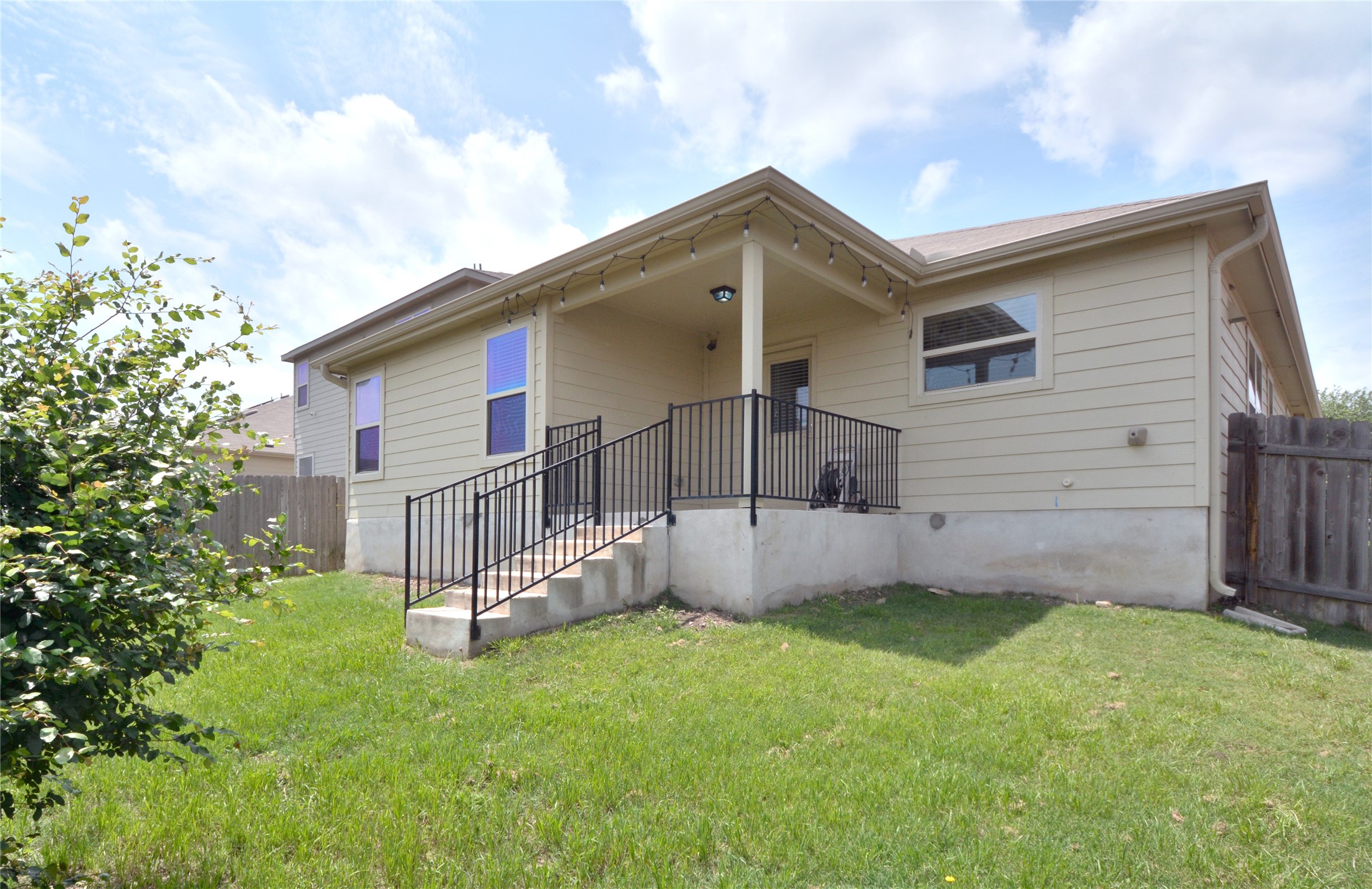 3901 Colorado High Avenue Austin, TX 78744 - Photo 34 of 39 a view of a house with a yard