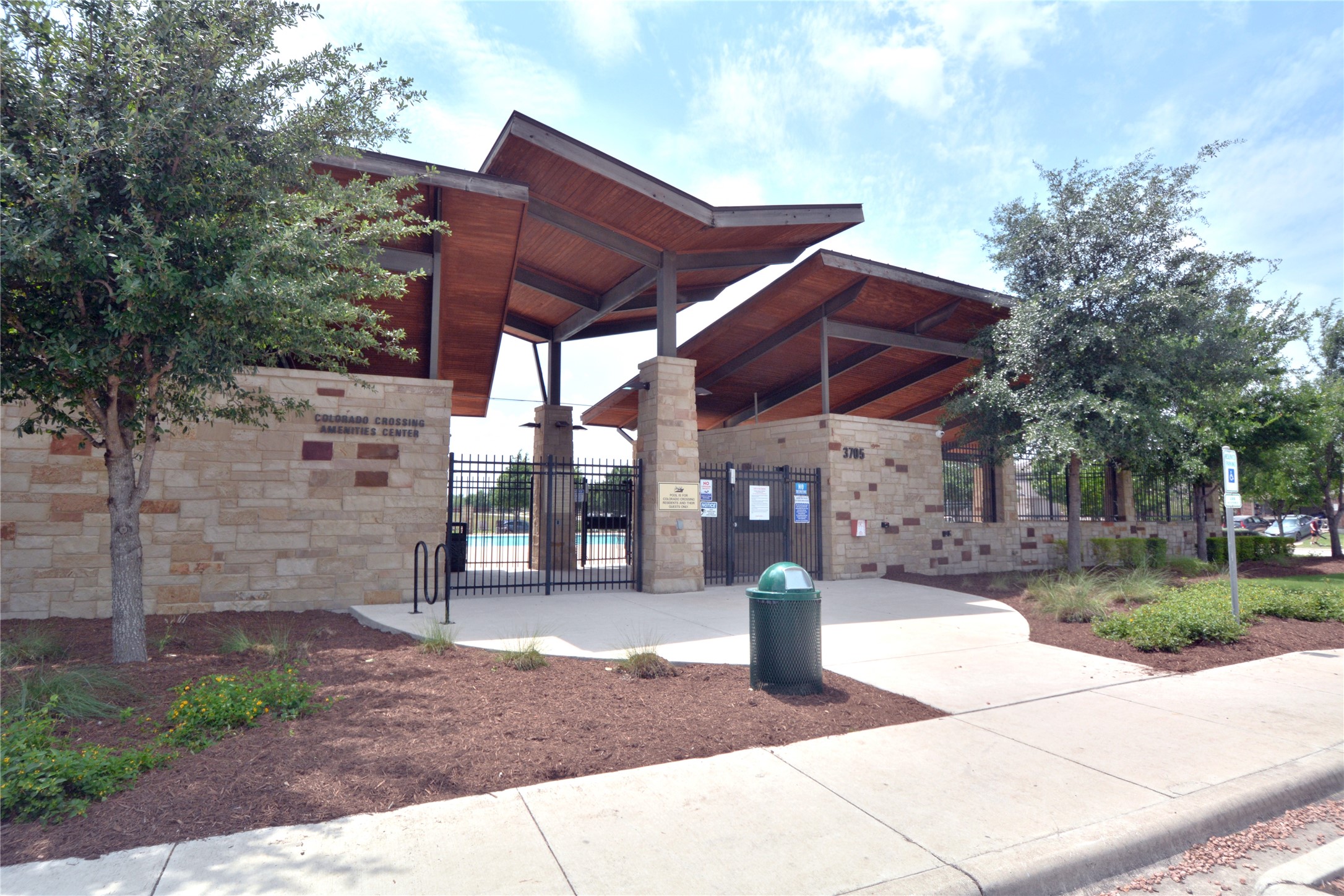 3901 Colorado High Avenue Austin, TX 78744 - Photo 35 of 39 a view of a patio with a table and chairs under an umbrella