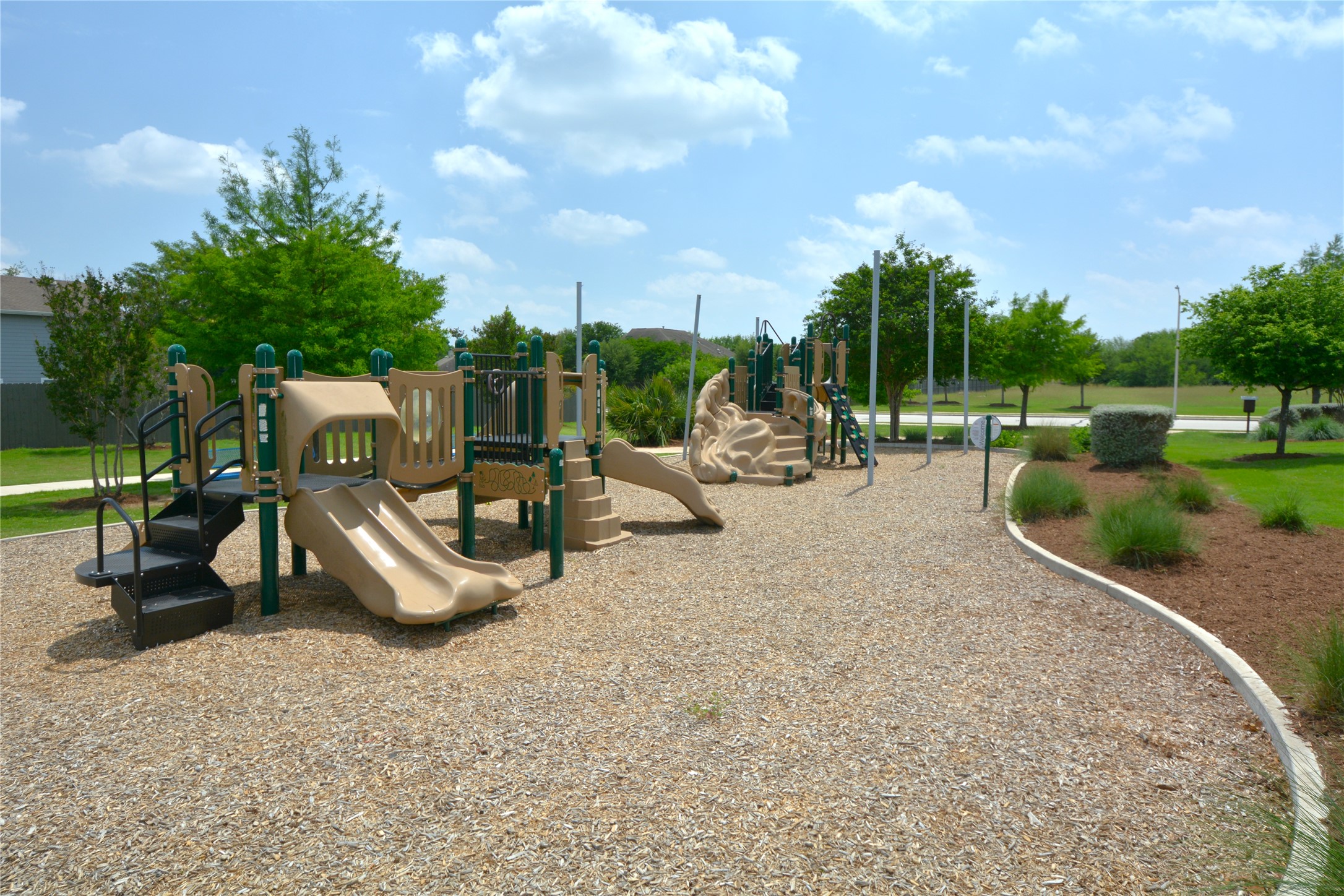 3901 Colorado High Avenue Austin, TX 78744 - Photo 39 of 39 a view of a park with swings and slides
