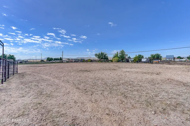 a backyard of a house with a tree