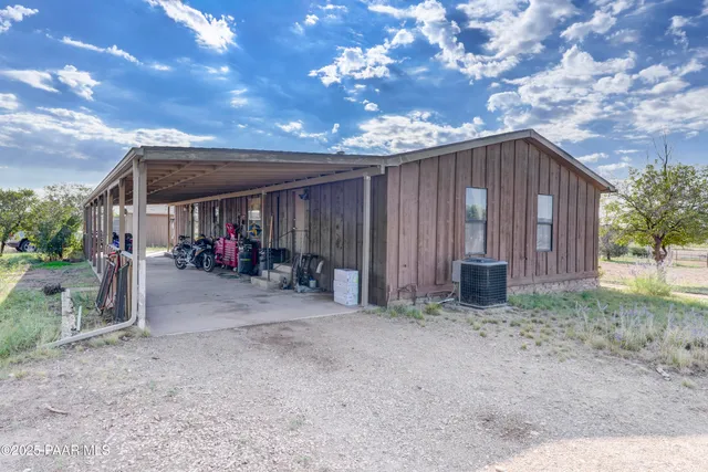 a view of a backyard of the house