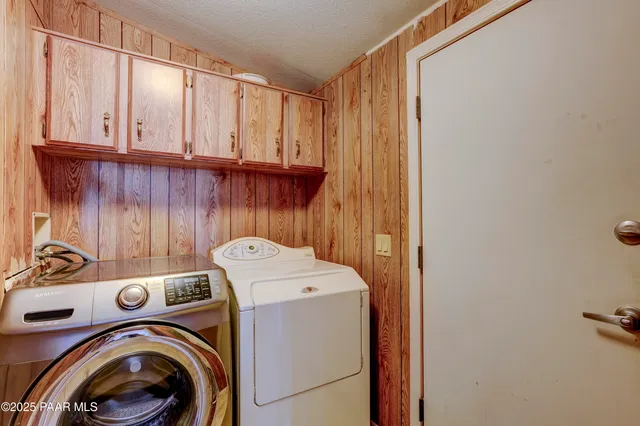 a bedroom with a bed and a tv