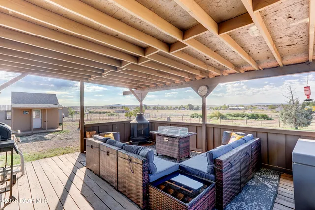 a living room with furniture tv and a table