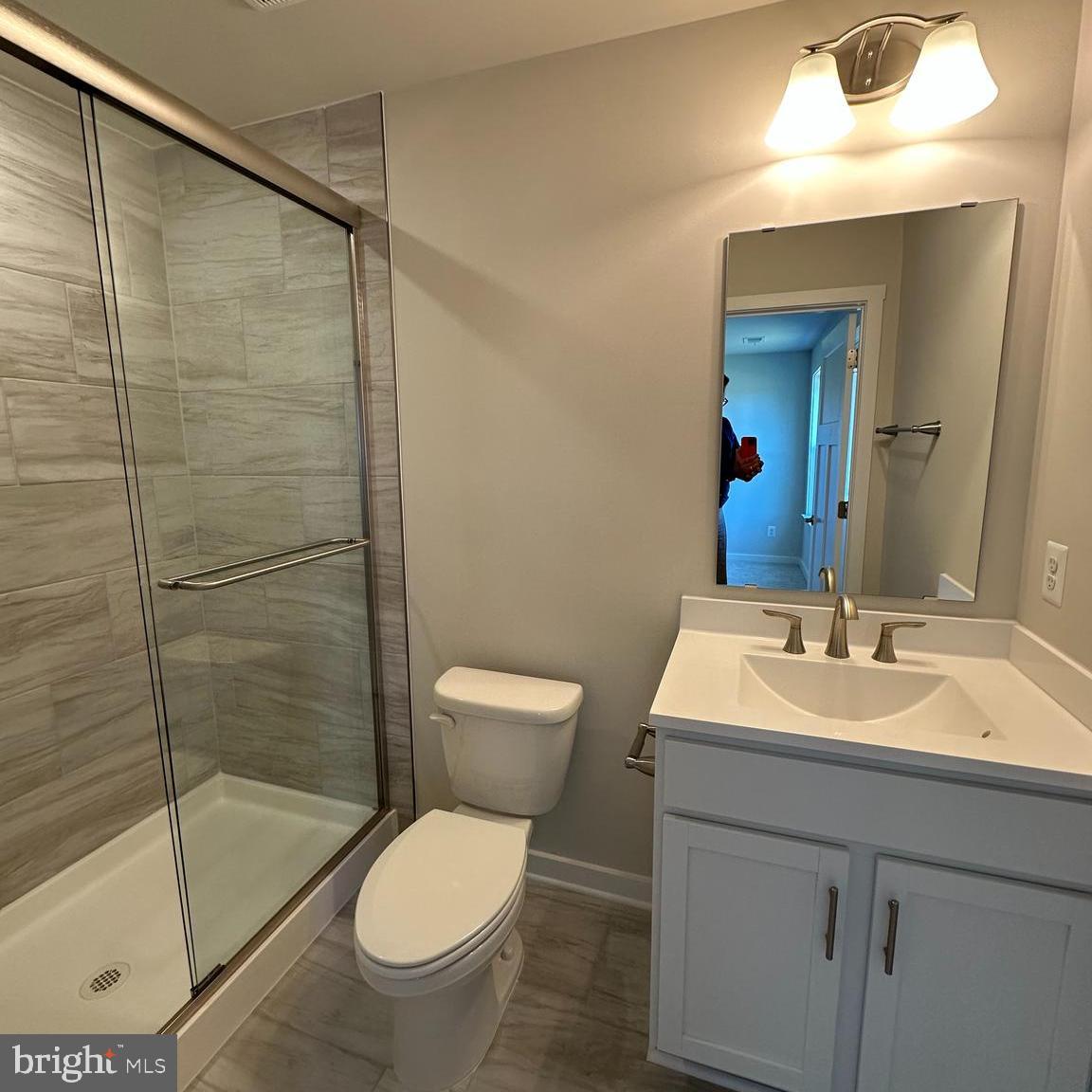 16 Zander Road Inwood, WV 25428 - Photo 7 of 36 a bathroom with a sink toilet and shower