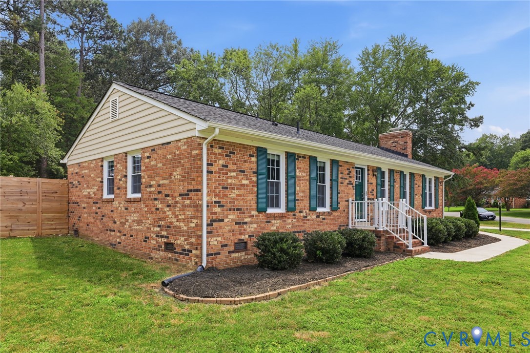 3221 Clintwood Road Midlothian, VA 23112 - Photo 3 of 46 Brick exterior with white trim, teal shutters, and