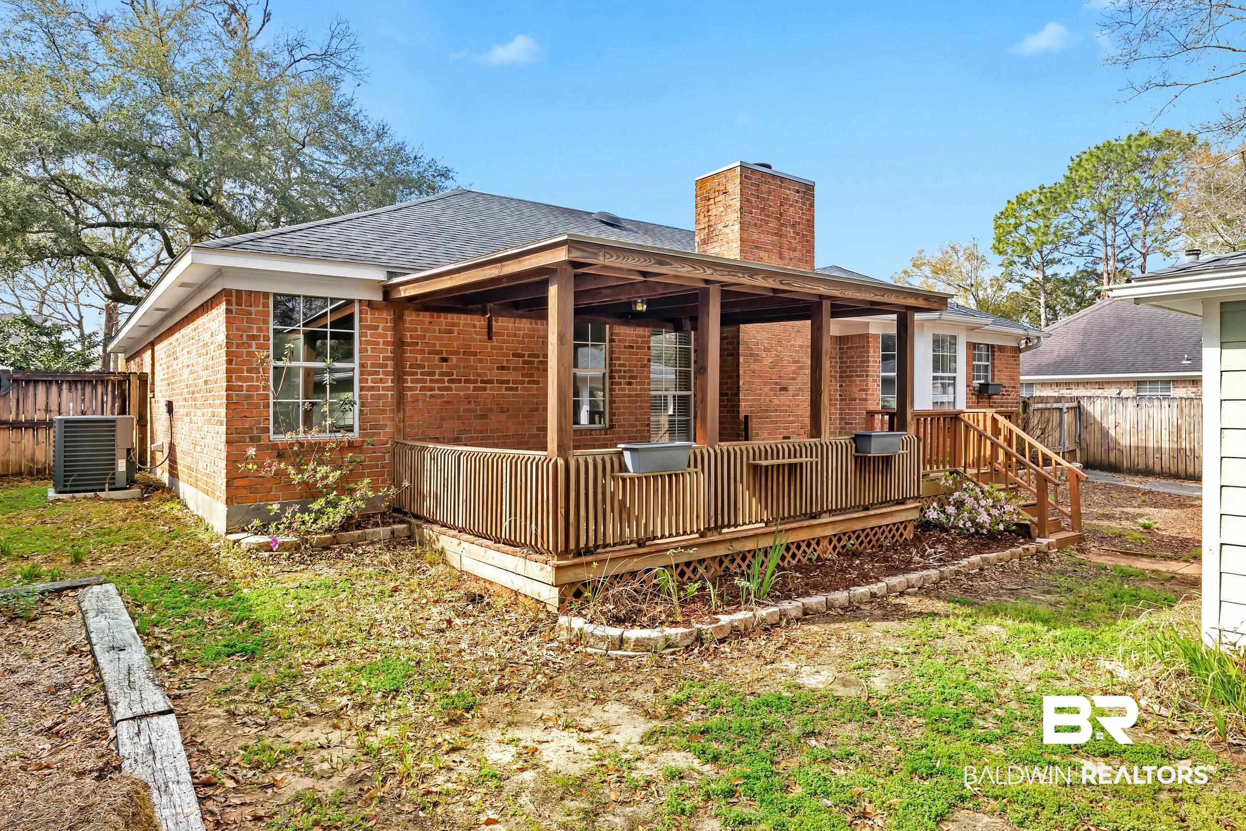 6616 Conde Court Mobile, AL 36695 - Photo 27 of 27 Rear view of house with brick siding, a chimney, central AC, and fence