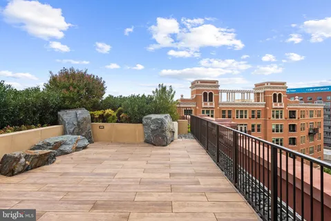a outdoor dining space with furniture and bathroom view