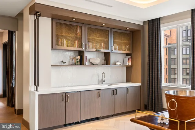 a front view of a building with a yard