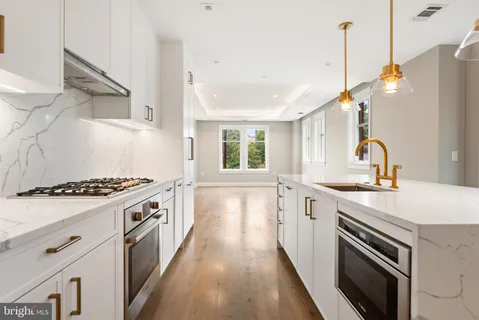 a kitchen with a stove and a sink