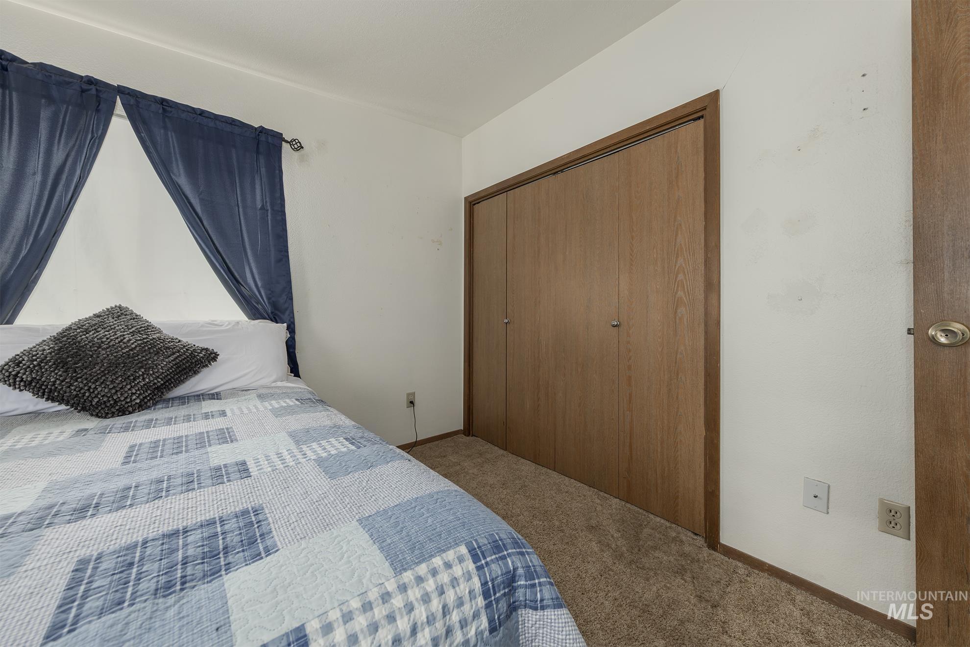 885 Airport Road Vale, OR 97918 - Photo 20 of 36 Bedroom with carpet floors and a closet