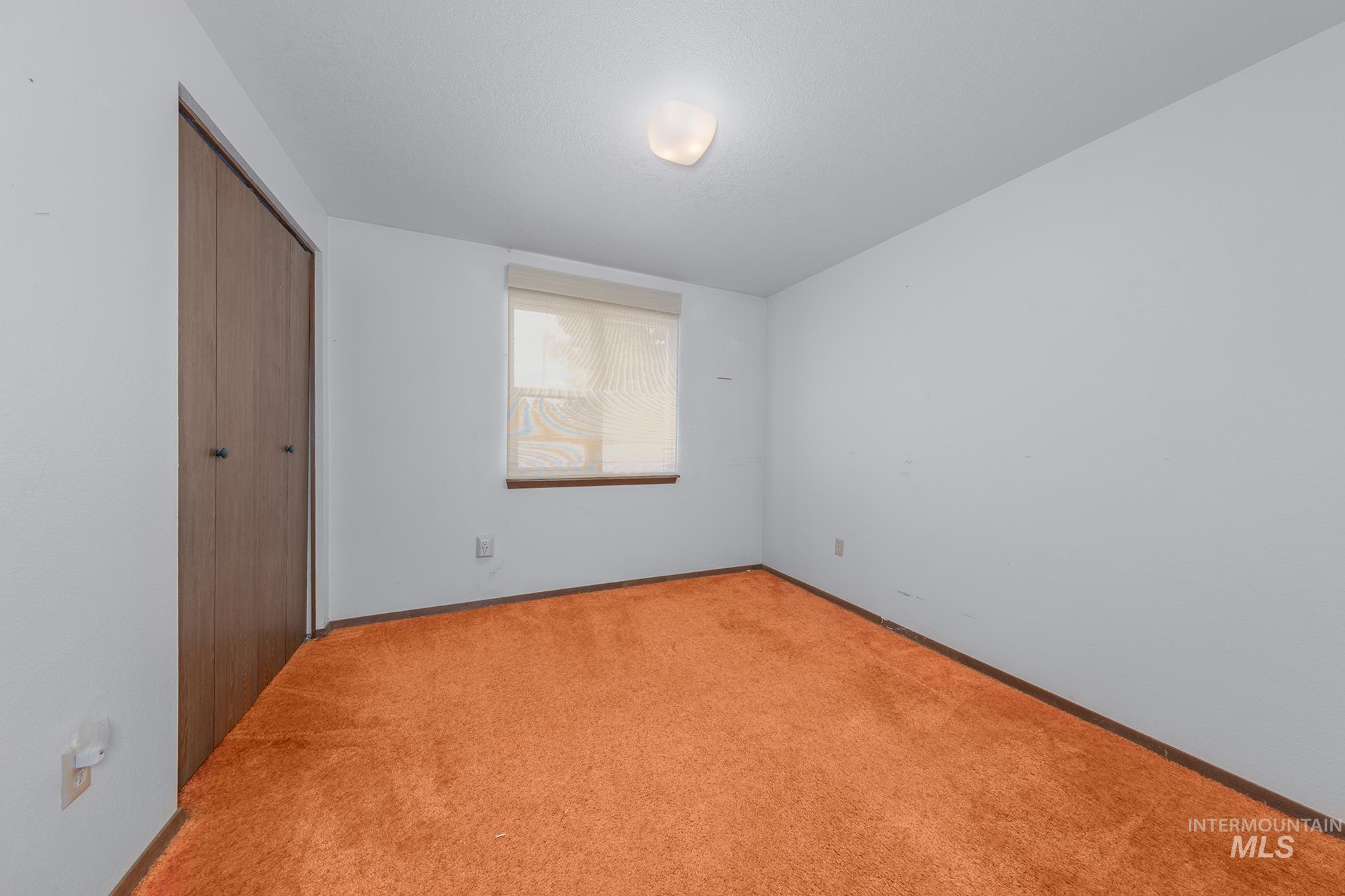 885 Airport Road Vale, OR 97918 - Photo 24 of 36 Unfurnished bedroom with a closet and carpet