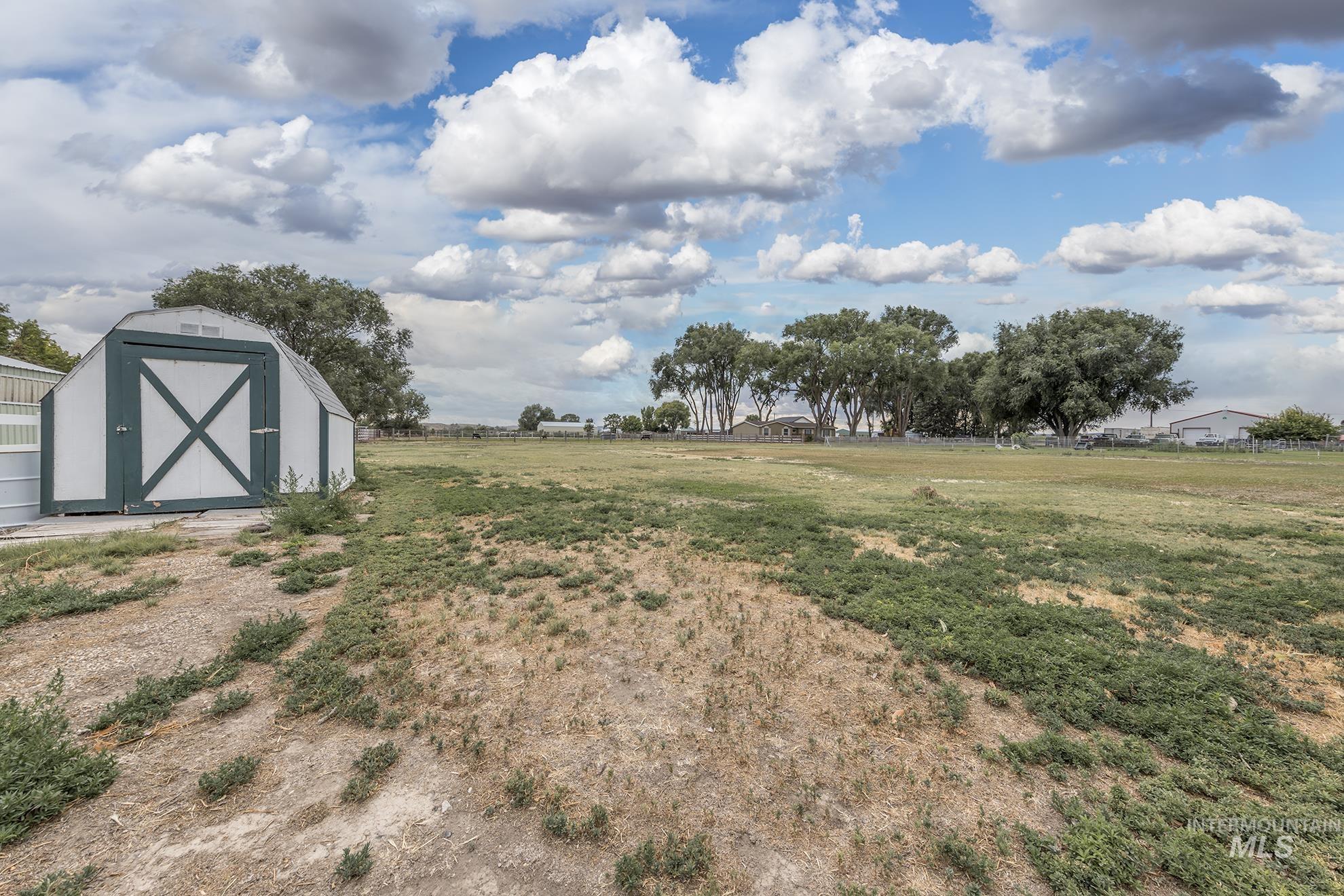 885 Airport Road Vale, OR 97918 - Photo 35 of 36 View of yard with a storage shed and a rural view