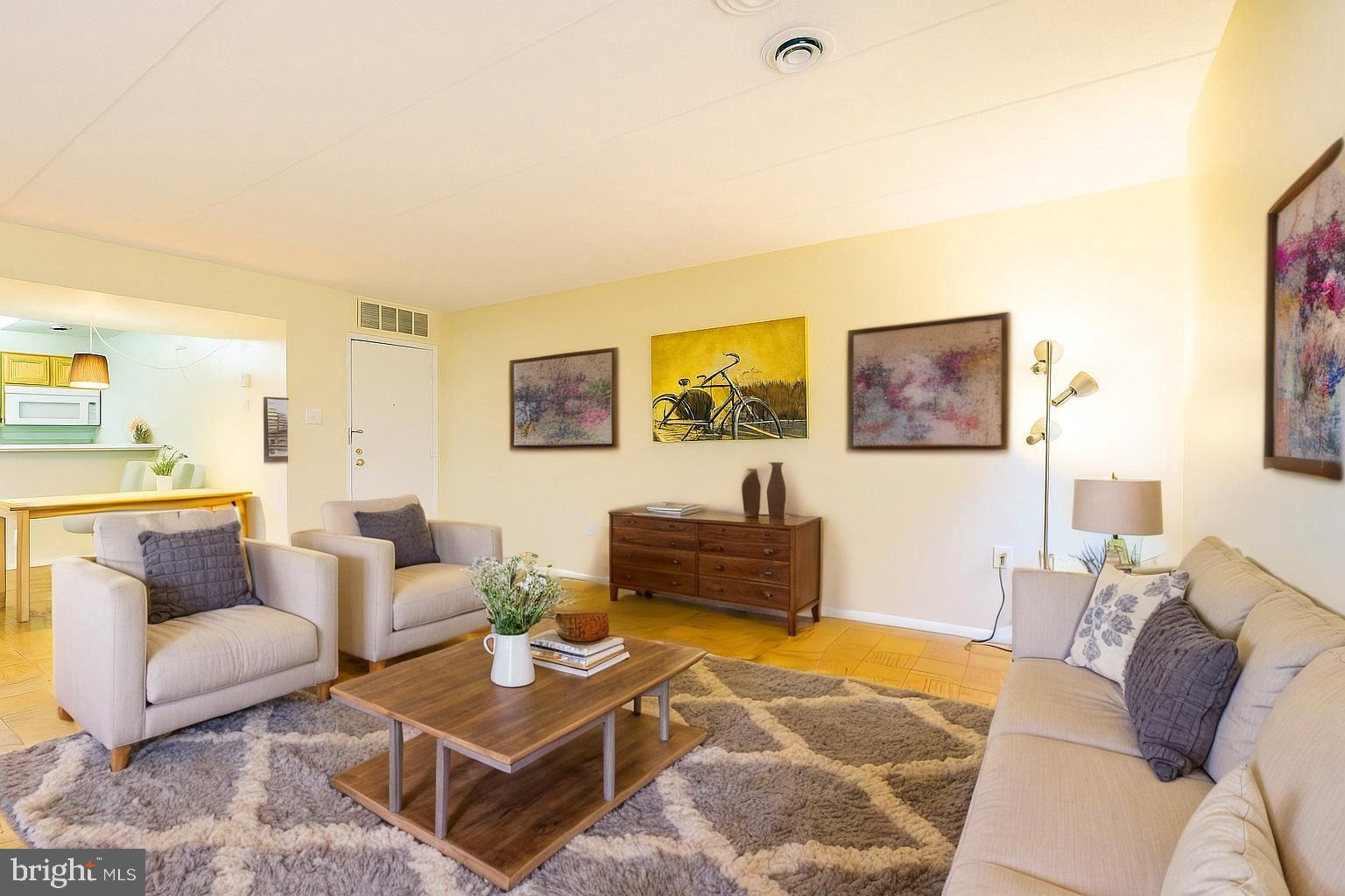 2605 Redcoat Drive, Unit 252 Alexandria, VA 22303 - Photo 2 of 26 a living room with furniture and a flat screen tv