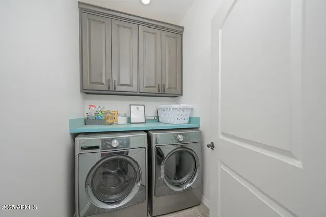 a bedroom with a bed and cabinets