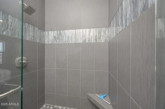 a bathroom with a tub and shower