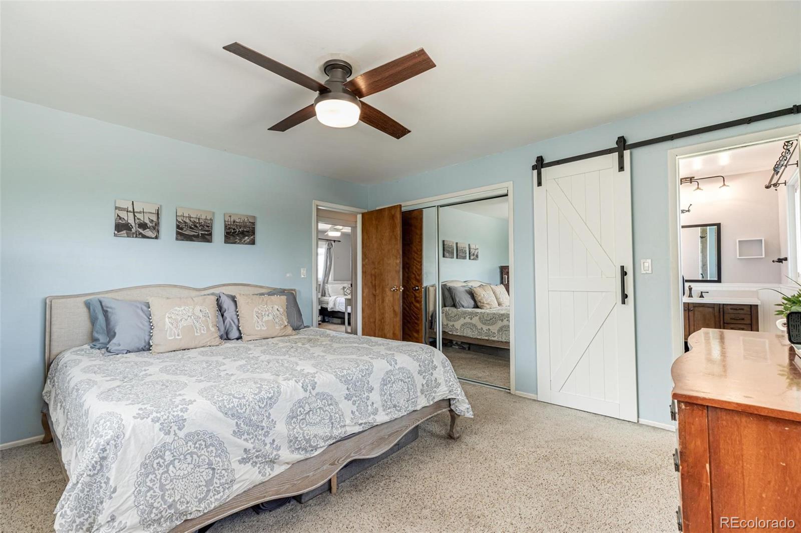 420 Clover Circle Hayden, CO 81639 - Photo 16 of 37 a bedroom with a bed and a large mirror