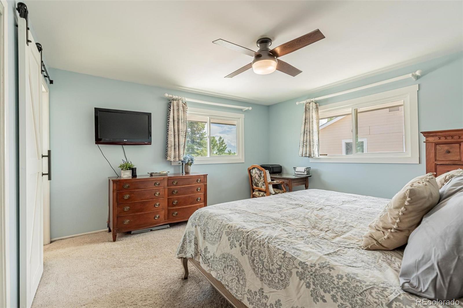 420 Clover Circle Hayden, CO 81639 - Photo 17 of 37 a bedroom with a bed and a flat screen tv