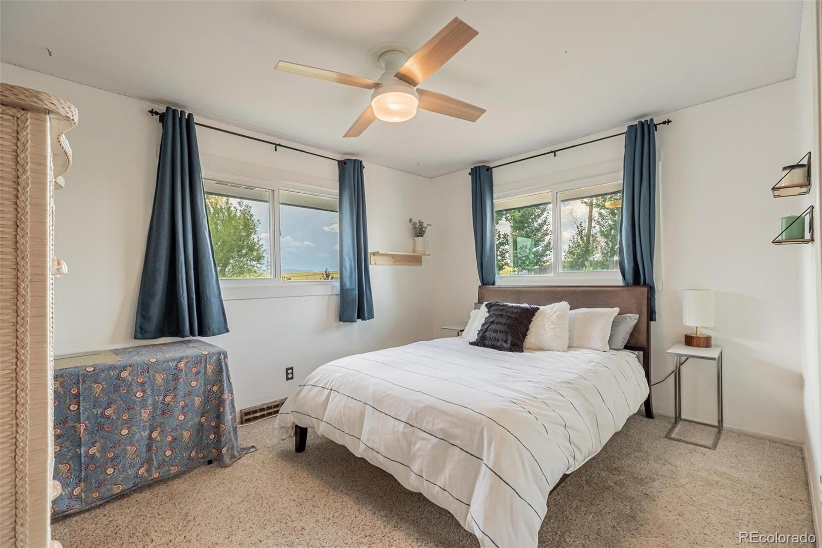 420 Clover Circle Hayden, CO 81639 - Photo 19 of 37 a bedroom with a large bed and a window