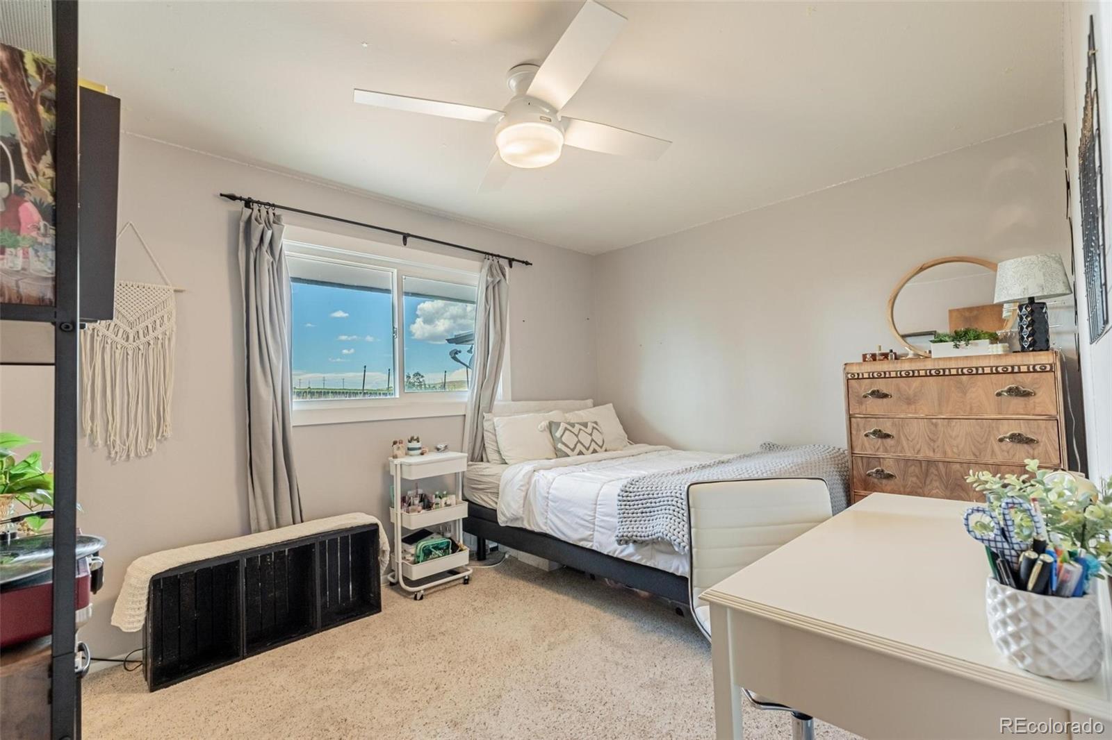 420 Clover Circle Hayden, CO 81639 - Photo 20 of 37 a bedroom with a bed and a table