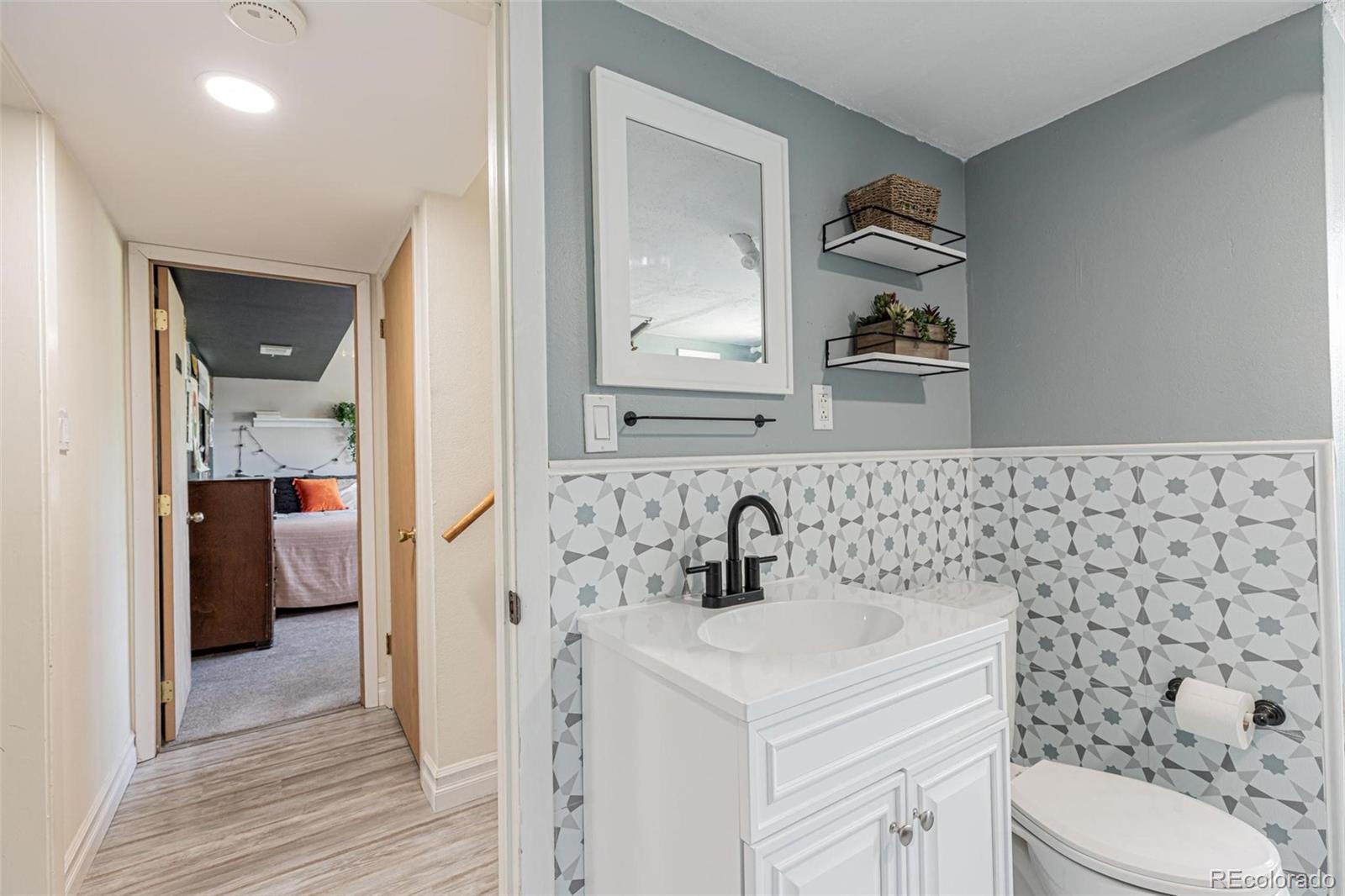 420 Clover Circle Hayden, CO 81639 - Photo 26 of 37 a bathroom with a toilet sink and mirror