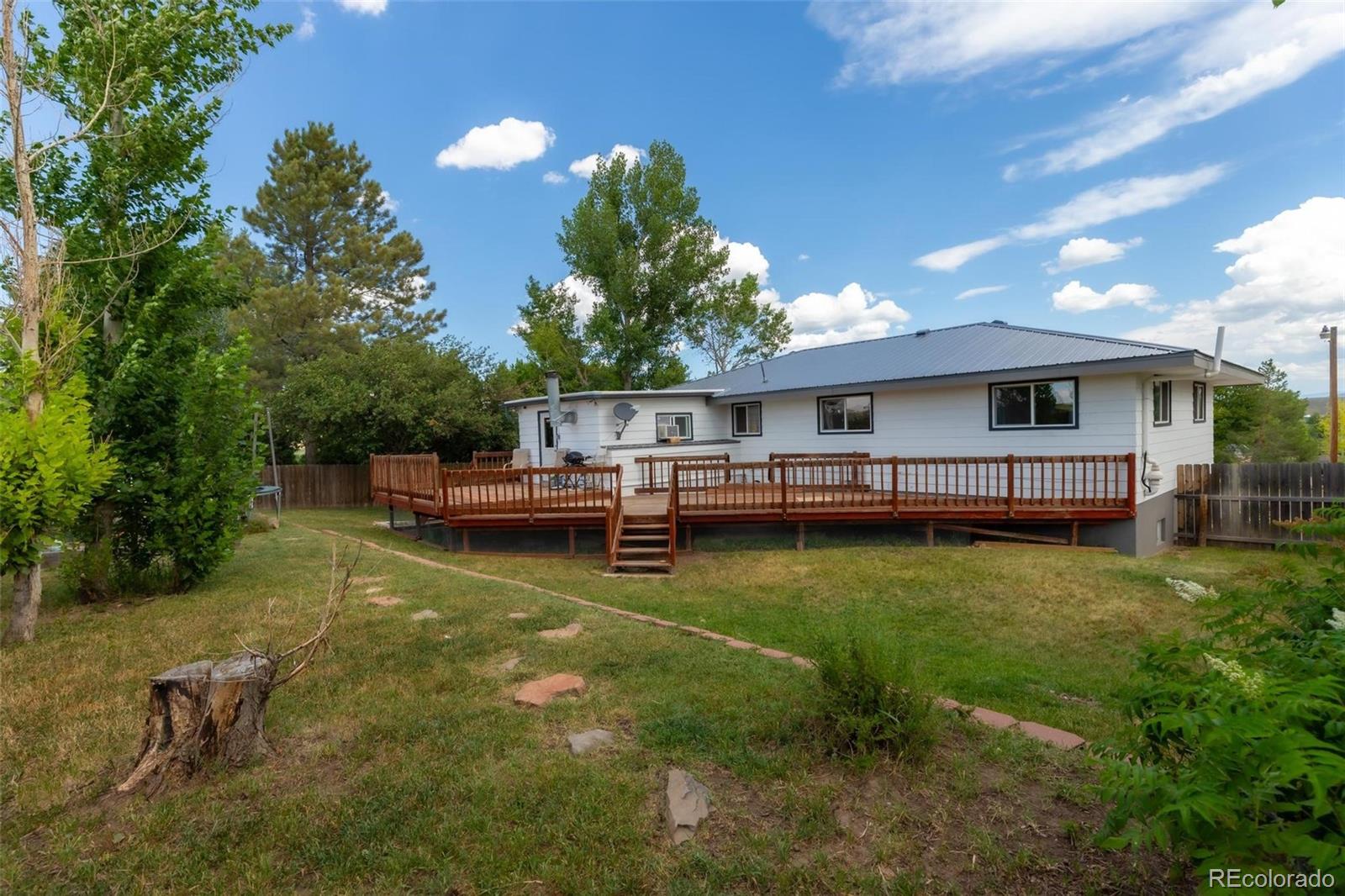 420 Clover Circle Hayden, CO 81639 - Photo 27 of 37 a view of a house with swimming pool next to a yard