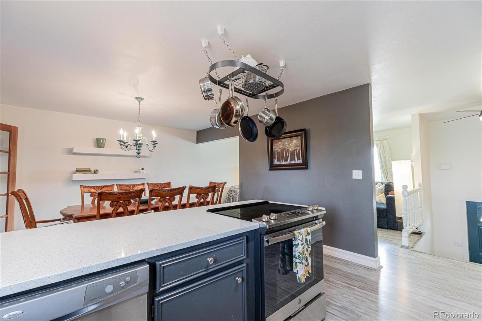 420 Clover Circle Hayden, CO 81639 - Photo 3 of 37 a view of a room with a chandelier furniture and wooden floor