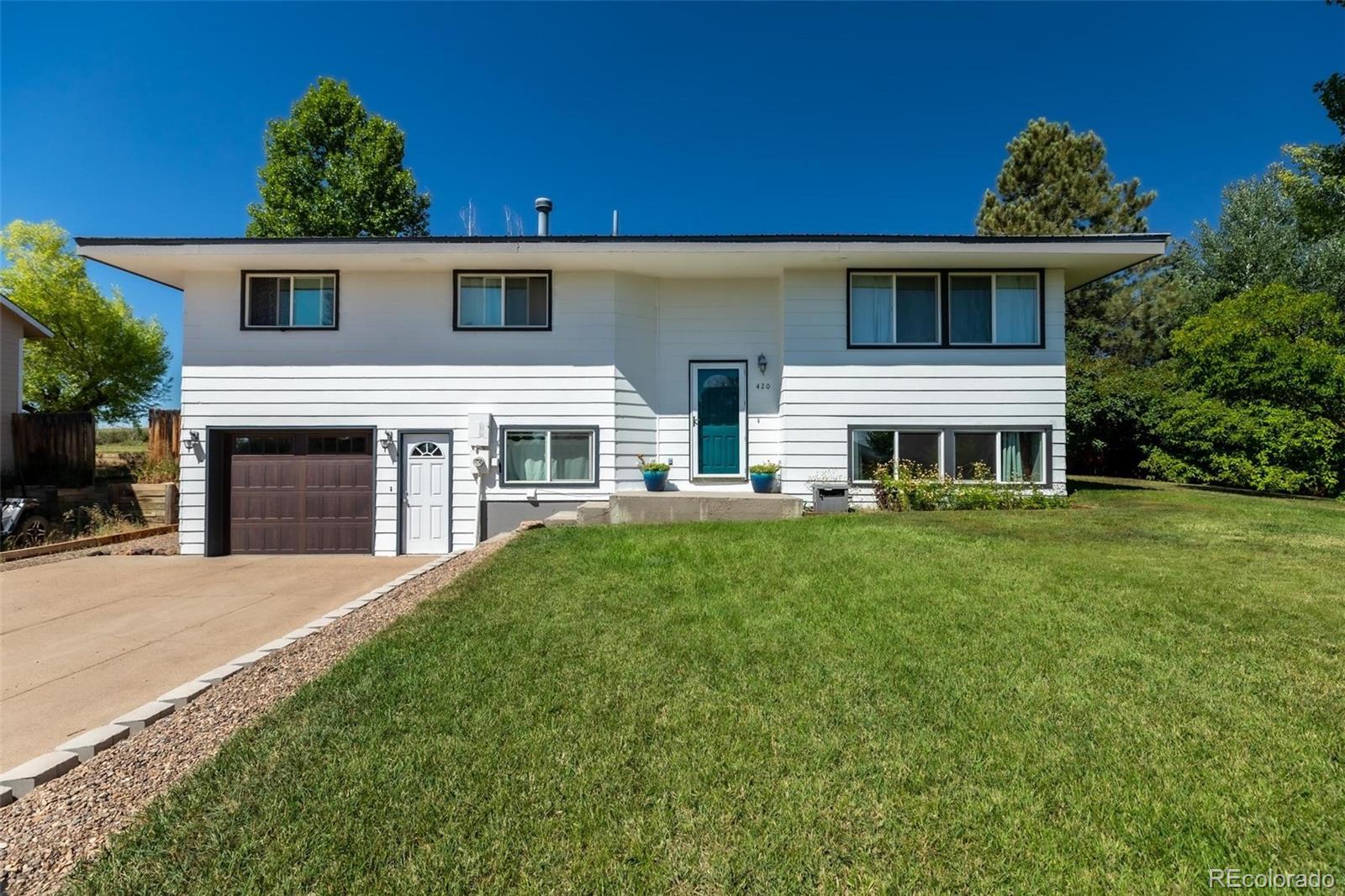 420 Clover Circle Hayden, CO 81639 - Photo 37 of 37 a front view of a house with a yard