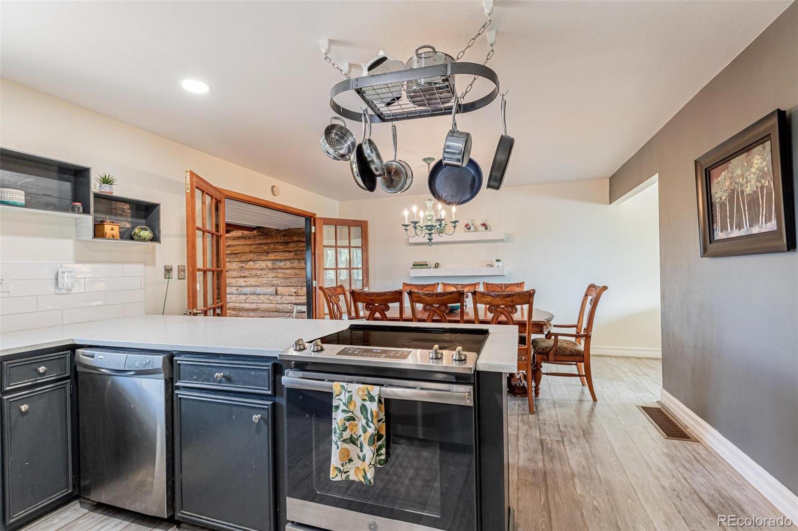 420 Clover Circle Hayden, CO 81639 - Photo 4 of 37 a kitchen with a stove and a wooden floor