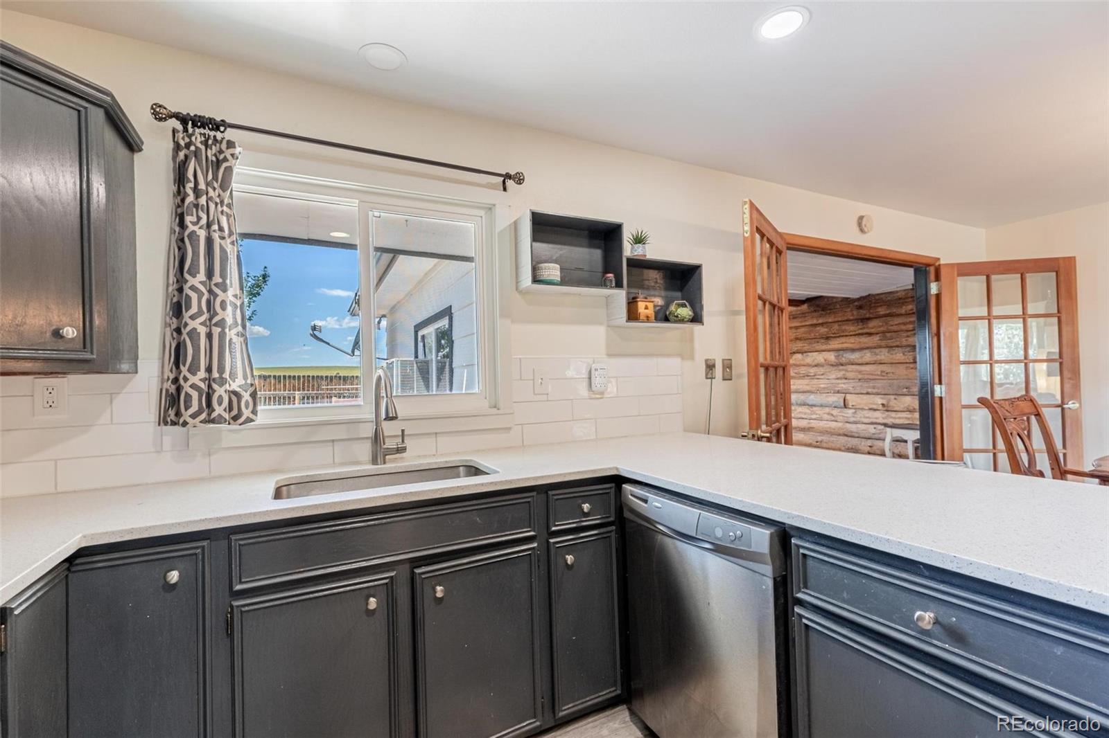 420 Clover Circle Hayden, CO 81639 - Photo 6 of 37 a kitchen with a sink and cabinets