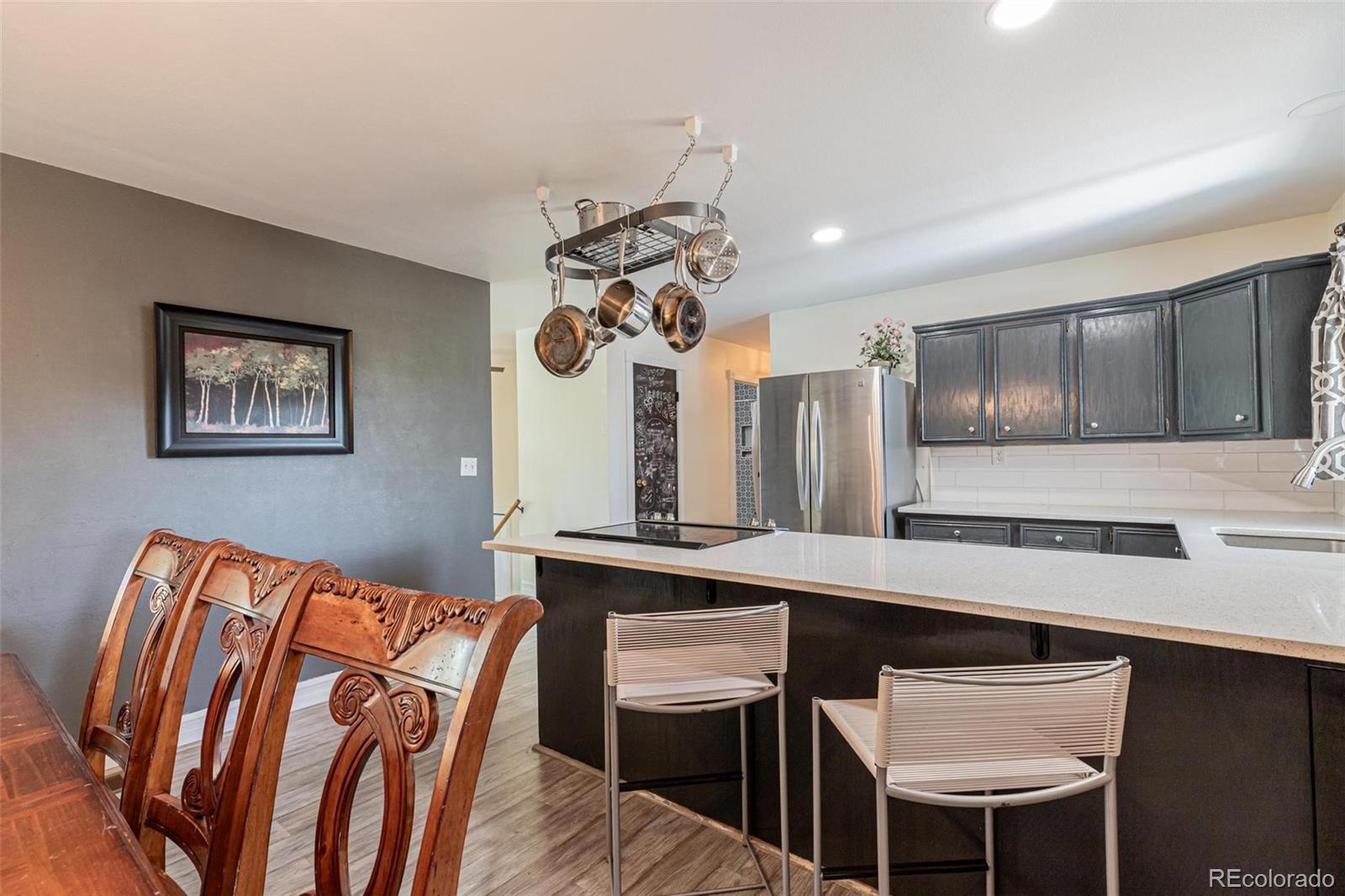 420 Clover Circle Hayden, CO 81639 - Photo 7 of 37 a view of a kitchen area with furniture and chandelier