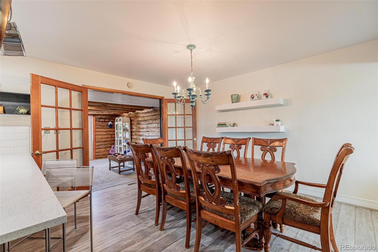 420 Clover Circle Hayden, CO 81639 - Photo 9 of 37 a view of a dining room with furniture window and wooden floor