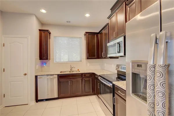a kitchen that has a sink and a stove in it