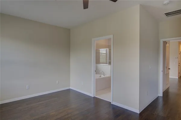 a bathroom with a tub and a sink