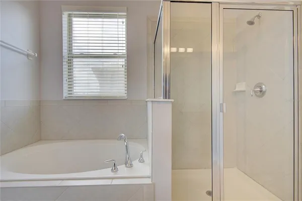 a view of a sink and a mirror in a kitchen