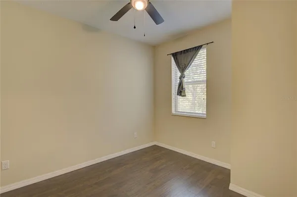 a bathroom with a sink toilet vanity and shower