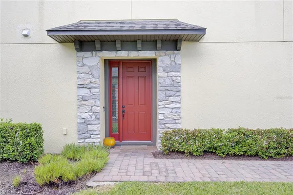 a view of a wooden door of the house