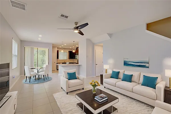 a living room with furniture a rug and a fireplace