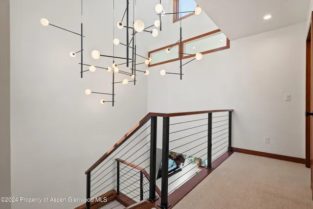 a bedroom with a bed couch and window