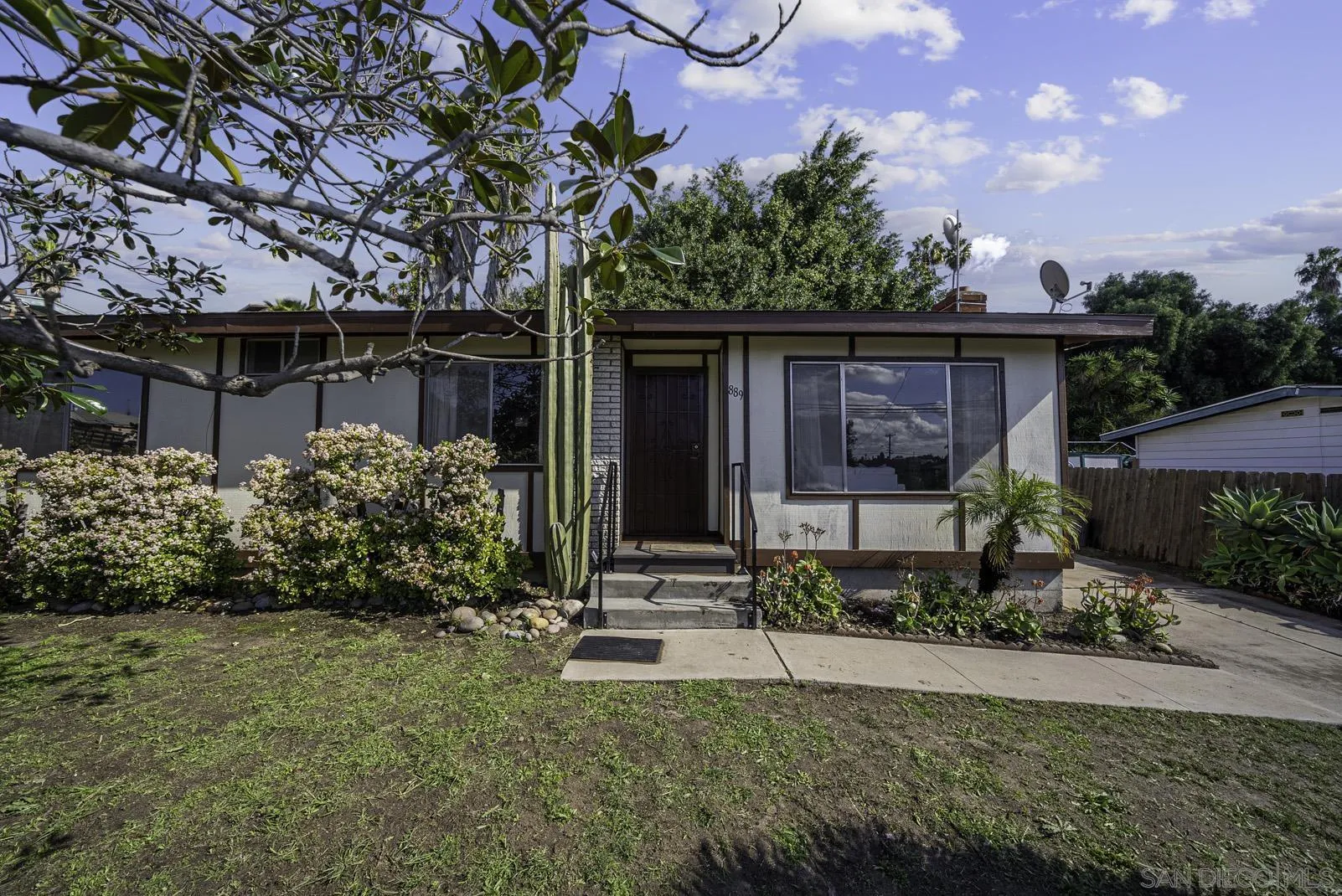 889 Galopago Street Spring Valley, CA 91977 - Photo 30 of 52 a front view of a house with garden