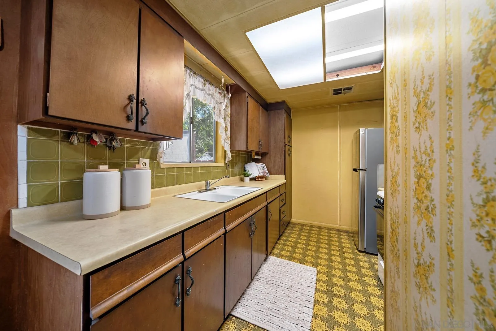 889 Galopago Street Spring Valley, CA 91977 - Photo 9 of 52 a bathroom with a sink and a mirror