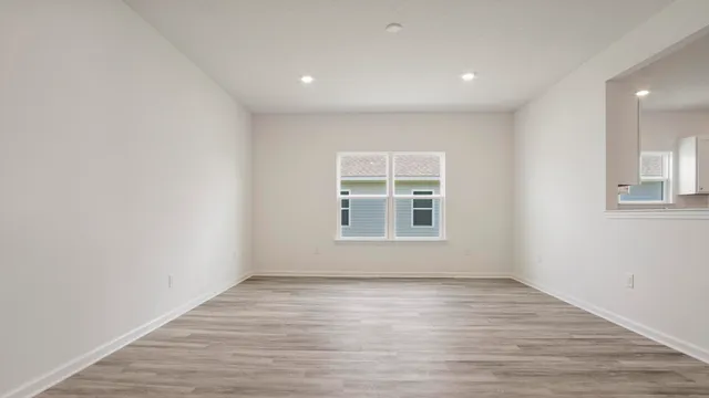 a view of hallway with wooden floor