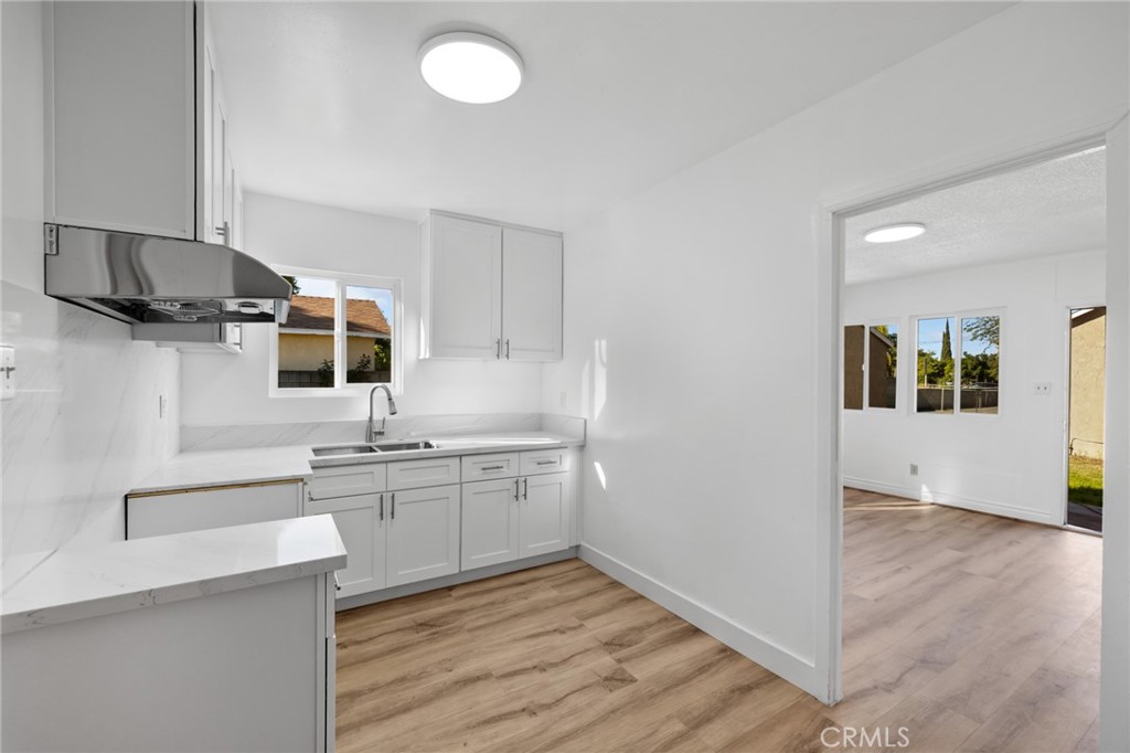 3912 Maple Avenue El Monte, CA 91731 - Photo 11 of 18 a kitchen with stainless steel appliances granite countertop a sink stove and microwave