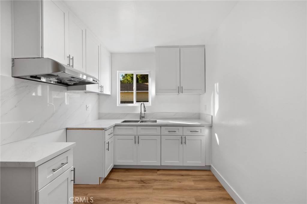 3912 Maple Avenue El Monte, CA 91731 - Photo 12 of 18 a kitchen with stainless steel appliances granite countertop a sink a stove and a refrigerator