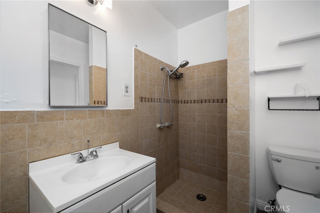 3912 Maple Avenue El Monte, CA 91731 - Photo 15 of 18 a bathroom with a sink toilet and shower