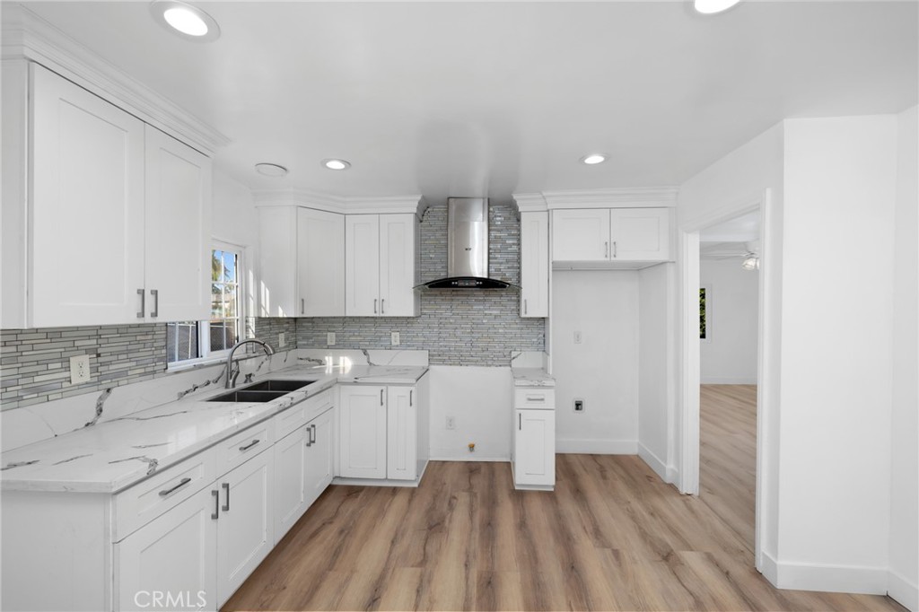 3912 Maple Avenue El Monte, CA 91731 - Photo 4 of 18 a kitchen with a sink stove and cabinets