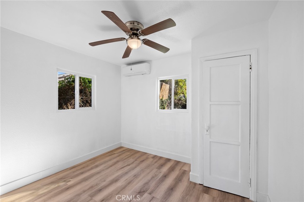 3912 Maple Avenue El Monte, CA 91731 - Photo 7 of 18 a view of a big room with wooden floor and windows