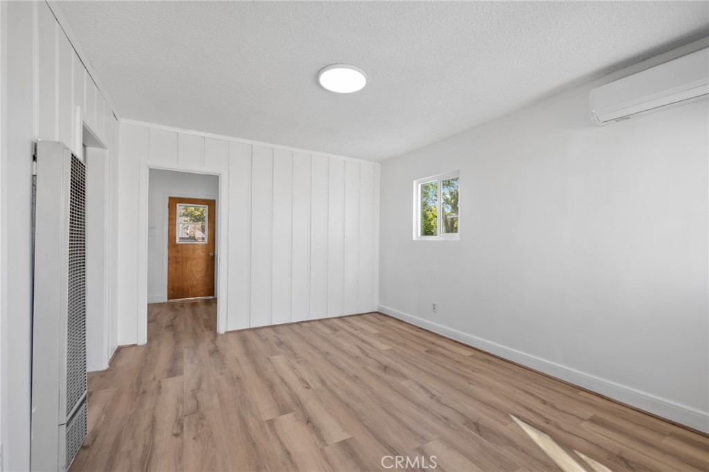 3912 Maple Avenue El Monte, CA 91731 - Photo 10 of 18 a view of empty room with wooden floor and fan
