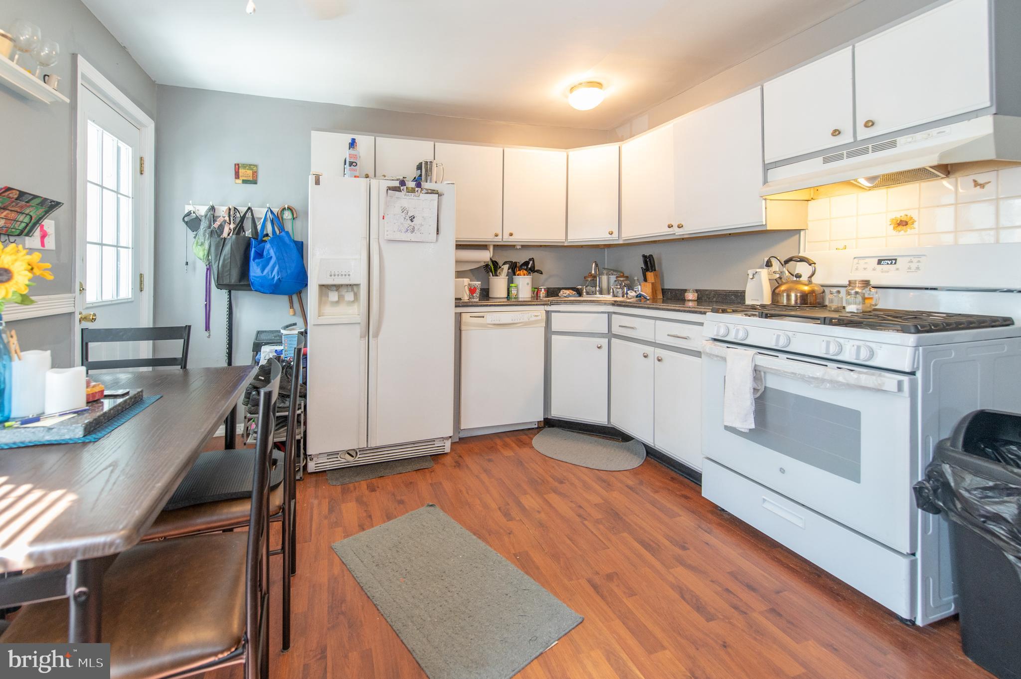 1034 Almonesson Road Westville, NJ 08093 - Photo 3 of 16 a kitchen with stainless steel appliances white cabinets a sink a stove a refrigerator and cabinets