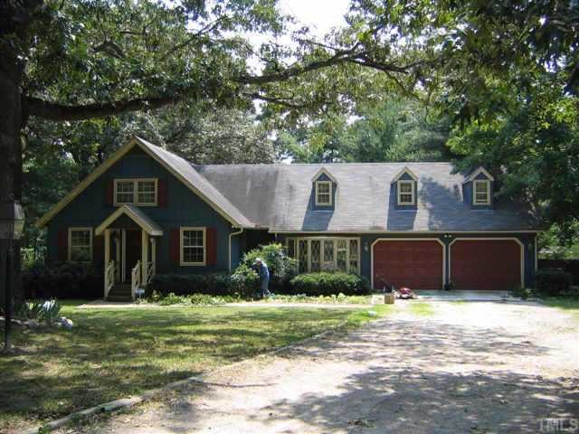 3913 Howard Circle Raleigh, NC 27604 - Photo 1 of 1 a front view of a house with a garden