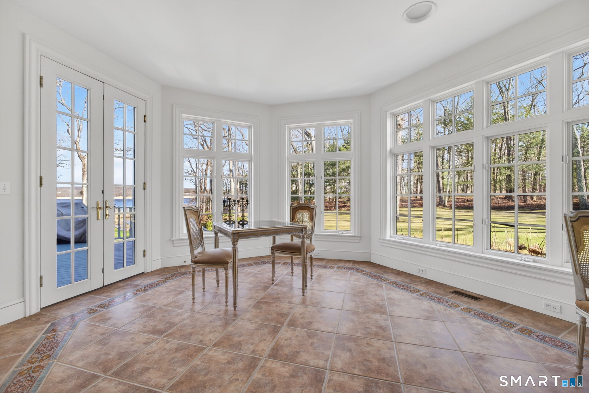 11 River Edge Road Old Saybrook, CT 06475 - Photo 15 of 39 Sunroom off the kitchen